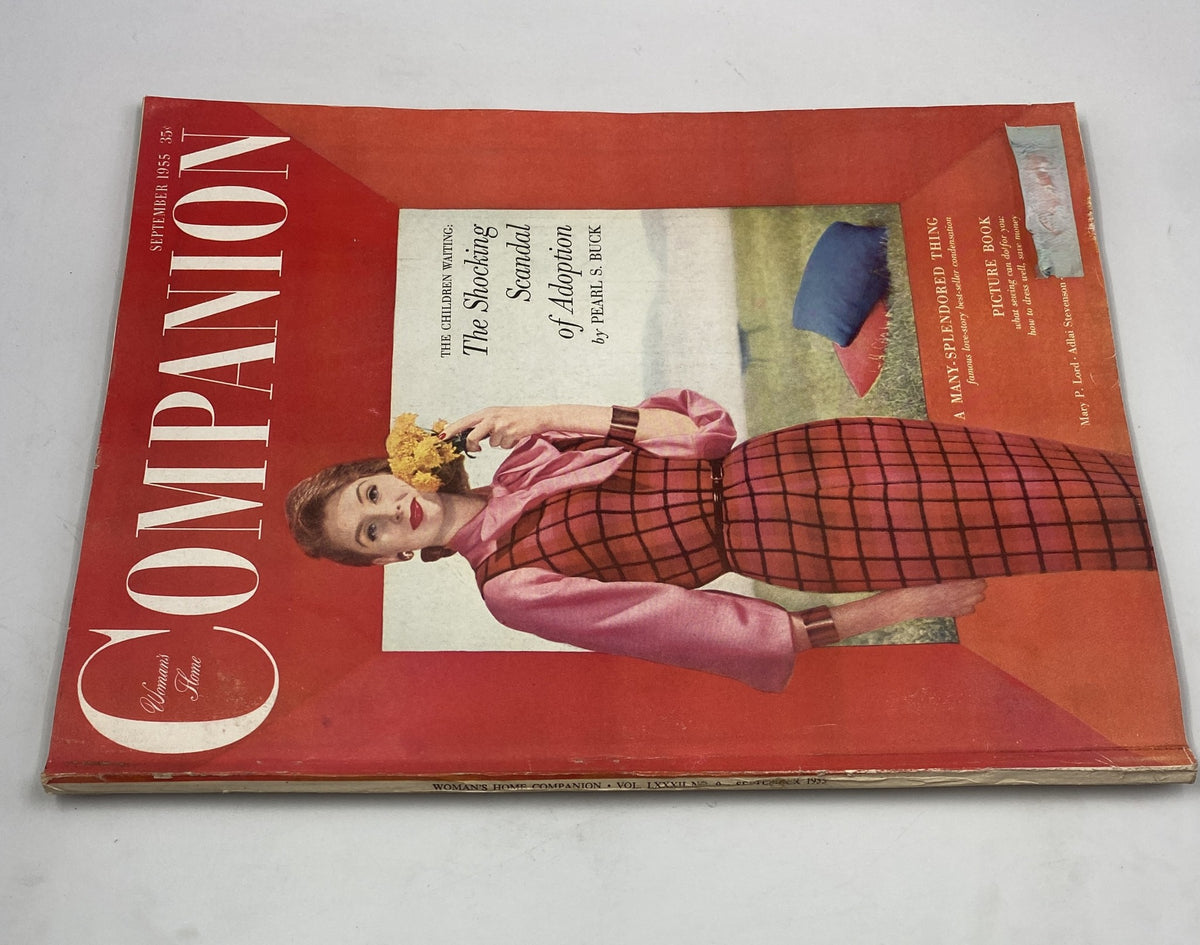 Side view of Woman's Home Companion Magazine September 1955 showing the title and illustration, featuring the article 'The Shocking Scandal of Adoption' by Pearl S. Buck on the cover.
