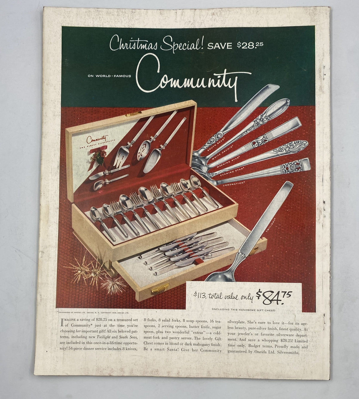 Woman's Home Companion Magazine December 1955 showcasing a Christmas special advertisement for Community silverware set, highlighting savings and the total value of the offer.