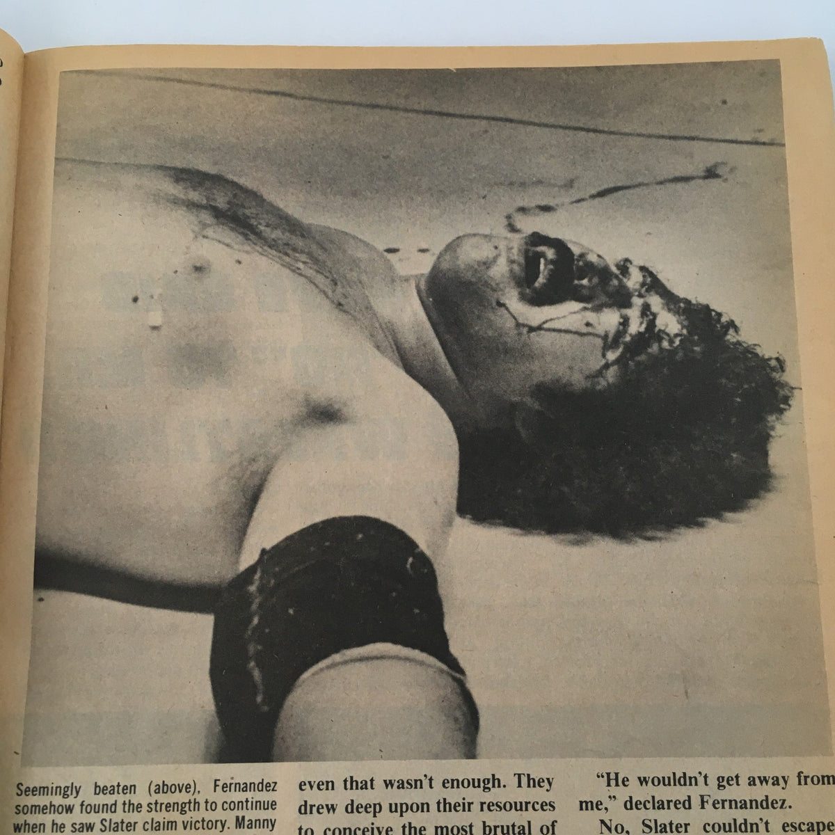 Black and white image from Inside Wrestling Magazine July 1981 showing a scene of intense wrestling action, depicting a character seemingly defeated.