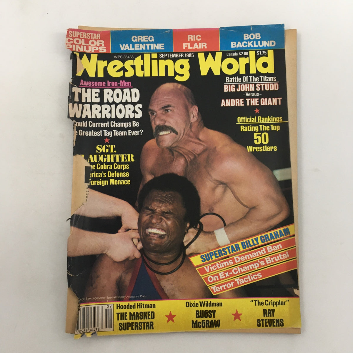 Wrestling World Magazine September 1985 cover featuring Andre the Giant vs Big John Studd, showcasing iconic wrestling highlights with the tagline 'Battle Of The Titans'.