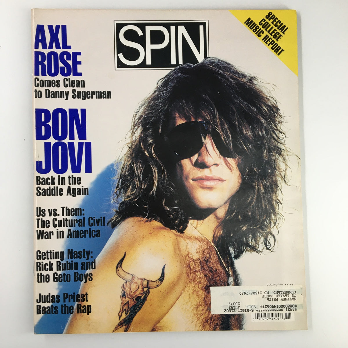 Spin Magazine November 1990 Vol 6 #8 featuring Axl Rose and Bon Jovi on the cover, showcasing iconic rock music figures of the early 1990s.