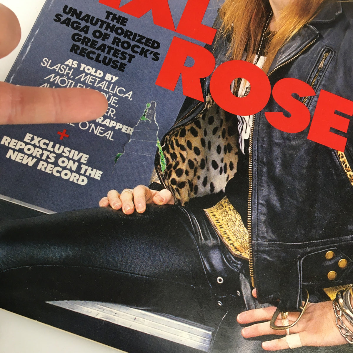 Cover of Spin Magazine July 1999 featuring Axl Rose and Slash, showcasing the unauthorized saga of rock's greatest recluse, along with Metallica and Mötley Crüe.