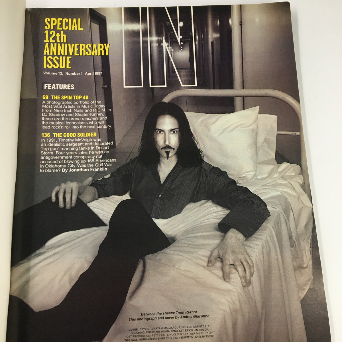 Inside page of Spin Magazine April 1997 Vol 13 #1 showcasing Trent Reznor seated on a bed, highlighting his presence in the issue with a focus on notable features of the edition.