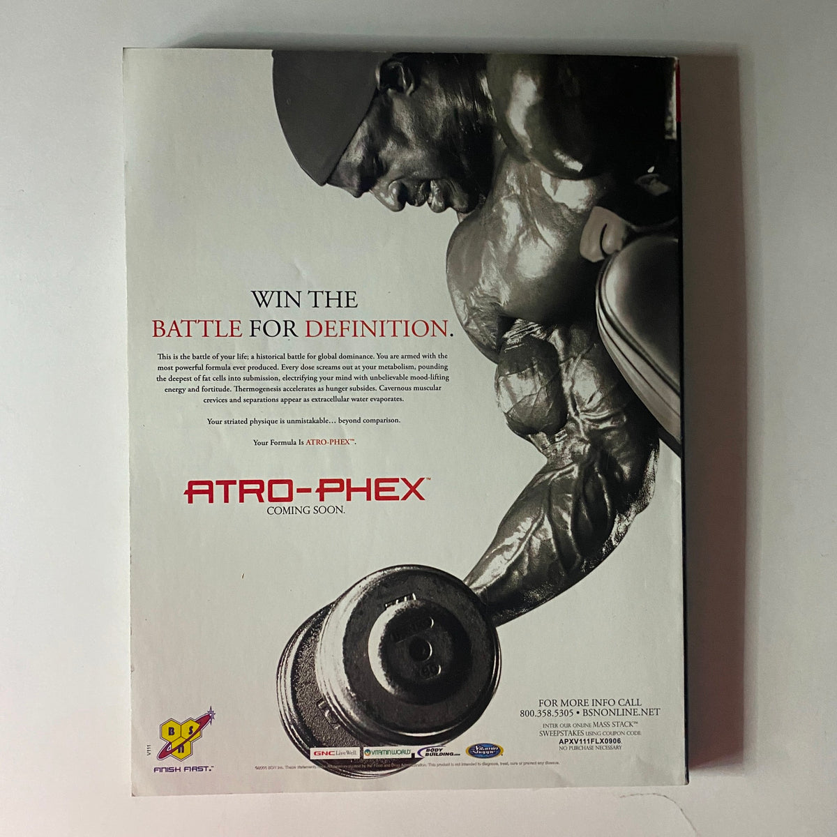 Back cover of Flex Magazine September 2006 featuring a muscular athlete lifting a dumbbell with the text 'Win the Battle for Definition' and a promotional announcement for ATRO-PHEX. This collectible magazine highlights fitness icons Jay Cutler and Christine Pomponio-Pate.