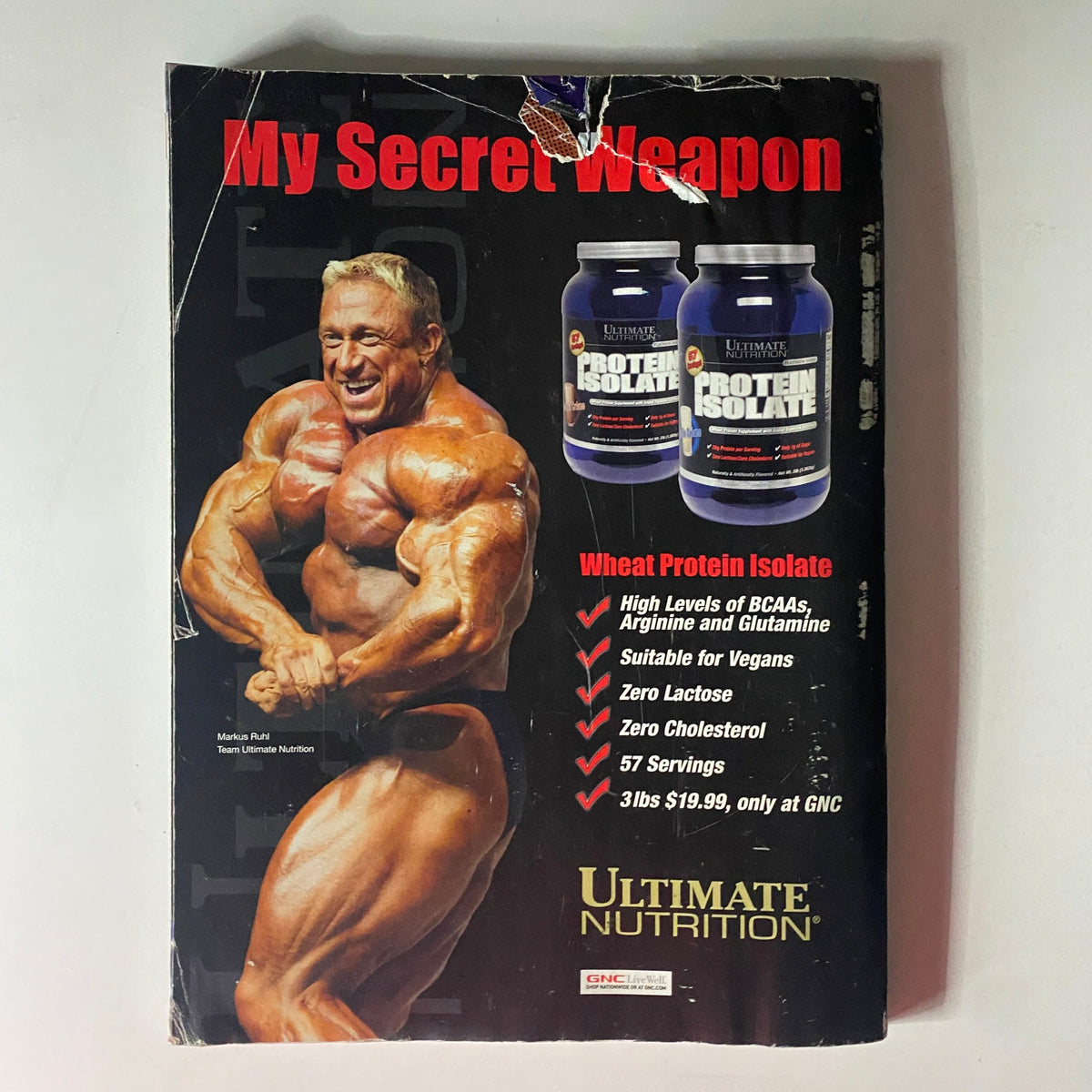 Back cover of Flex Magazine August 2008, advertising Ultimate Nutrition's protein isolate product with a muscular bodybuilder.