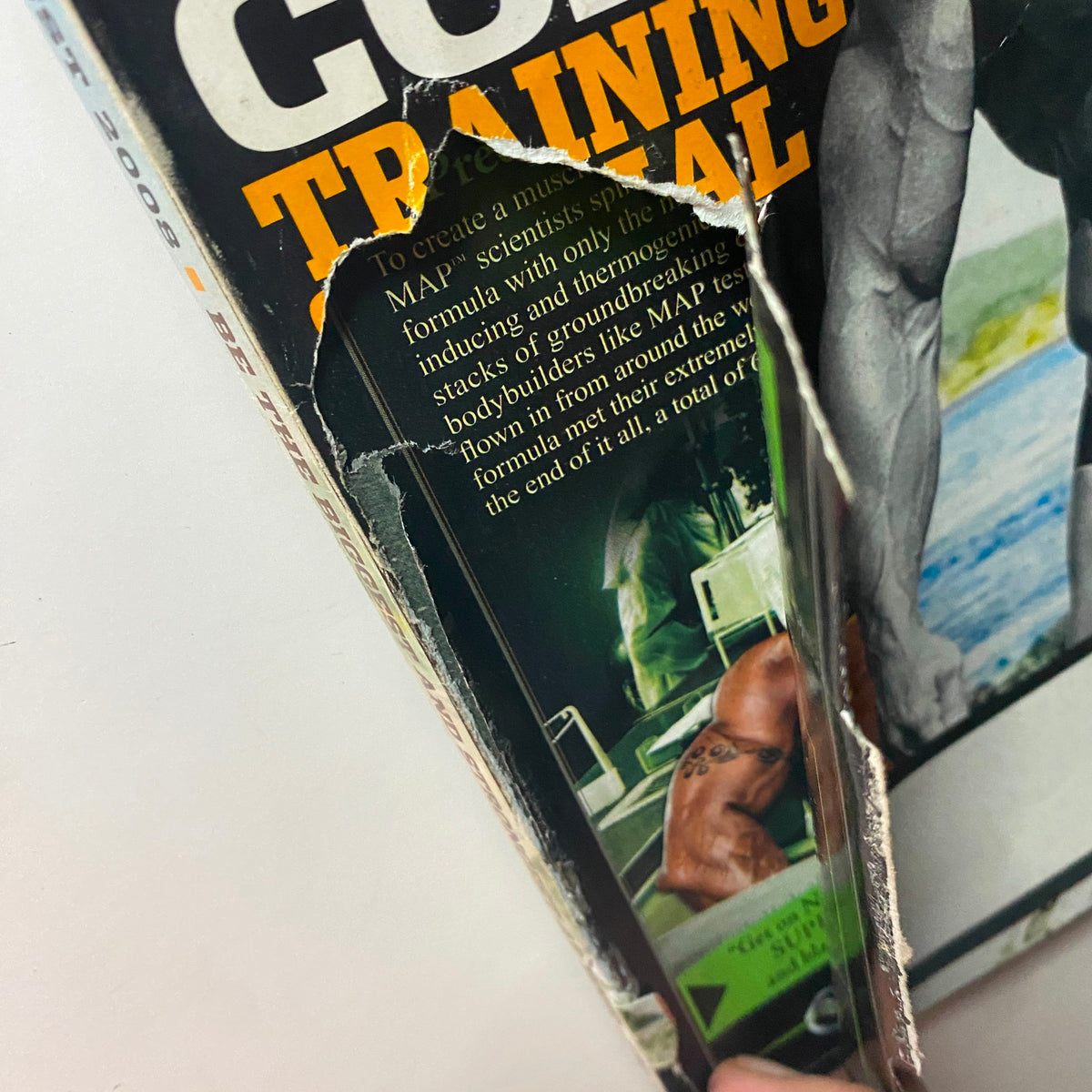 Close-up side view of Flex Magazine August 2008, showing the magazine's wear and tear, emphasizing its vintage collectible status.