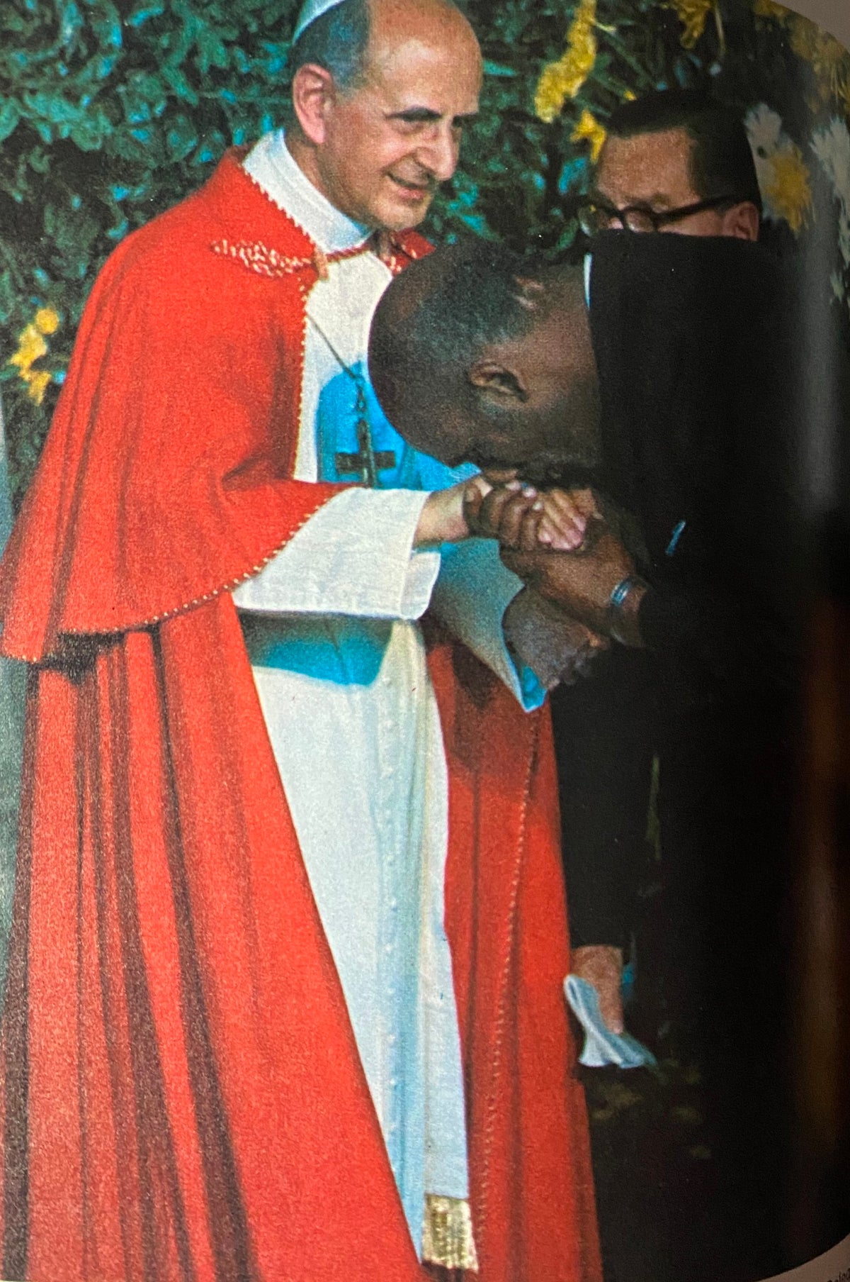 1965 Time Life Special Report: The Pope's Visit - Image of Pope Paul VI smiling while greeting a man, showcasing the warmth of his interactions during his visit.