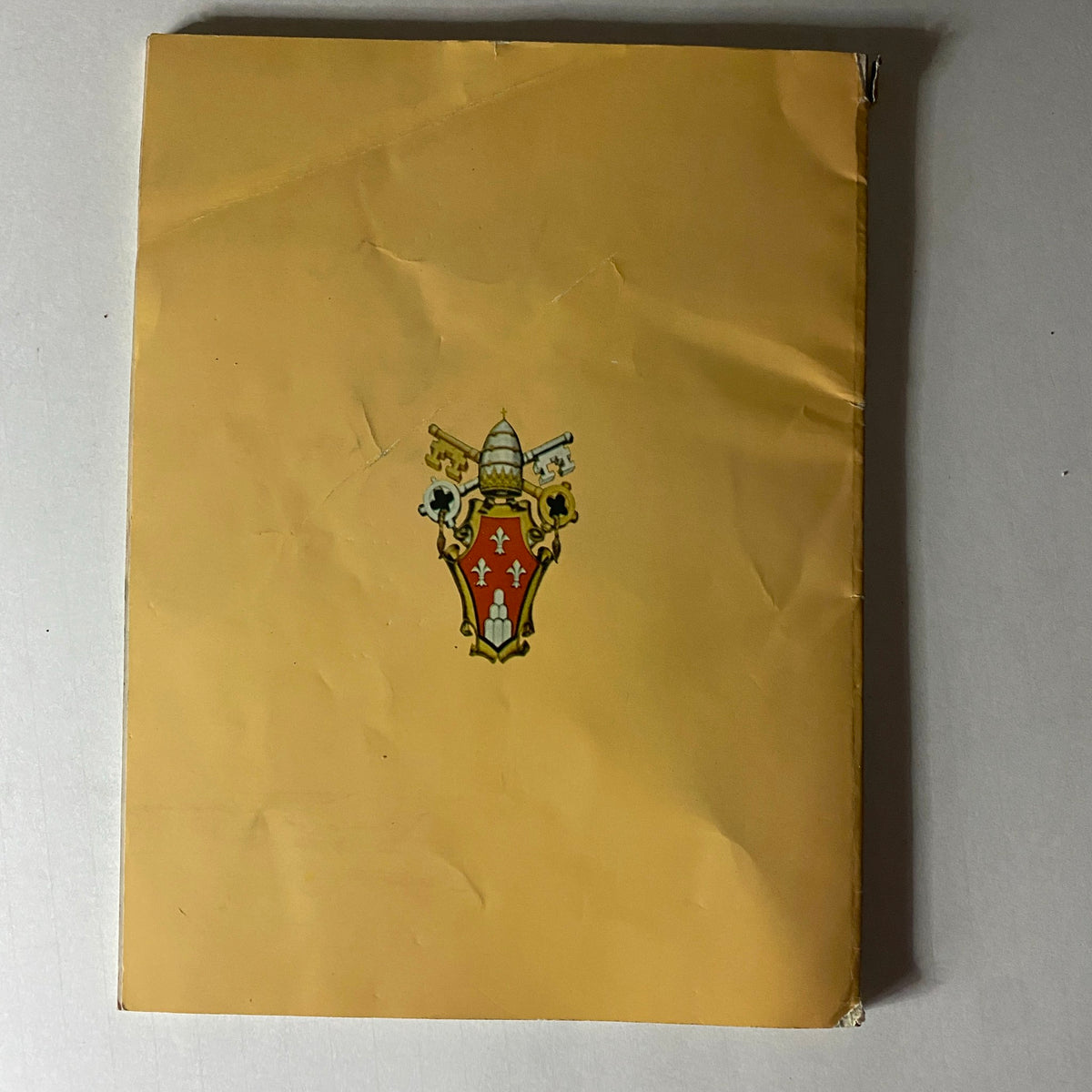 Cover of the 1965 Time Life Special Report: The Pope's Visit (Pope Paul VI), featuring the emblem of the Vatican on a vintage magazine with a yellow background.