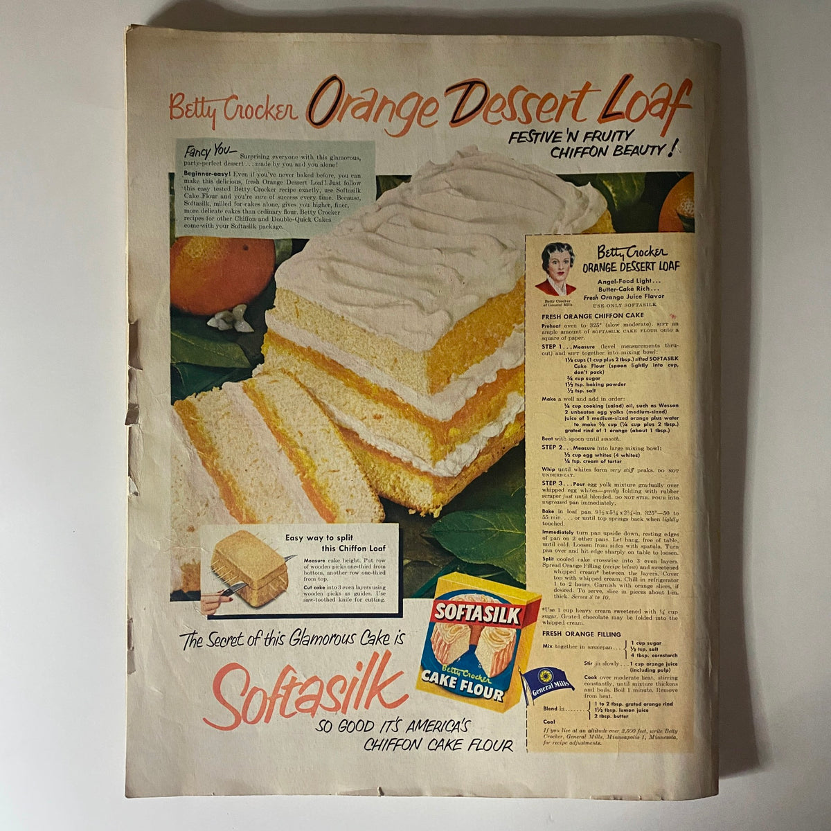 Vintage Betty Crocker Orange Dessert Loaf advertisement featuring a festive chiffon cake with recipe instructions. The ad highlights the use of Softasilk cake flour to create a fluffy orange dessert, showcasing the vibrant colors and presentation from the February 1951 edition of Ladies' Home Journal.