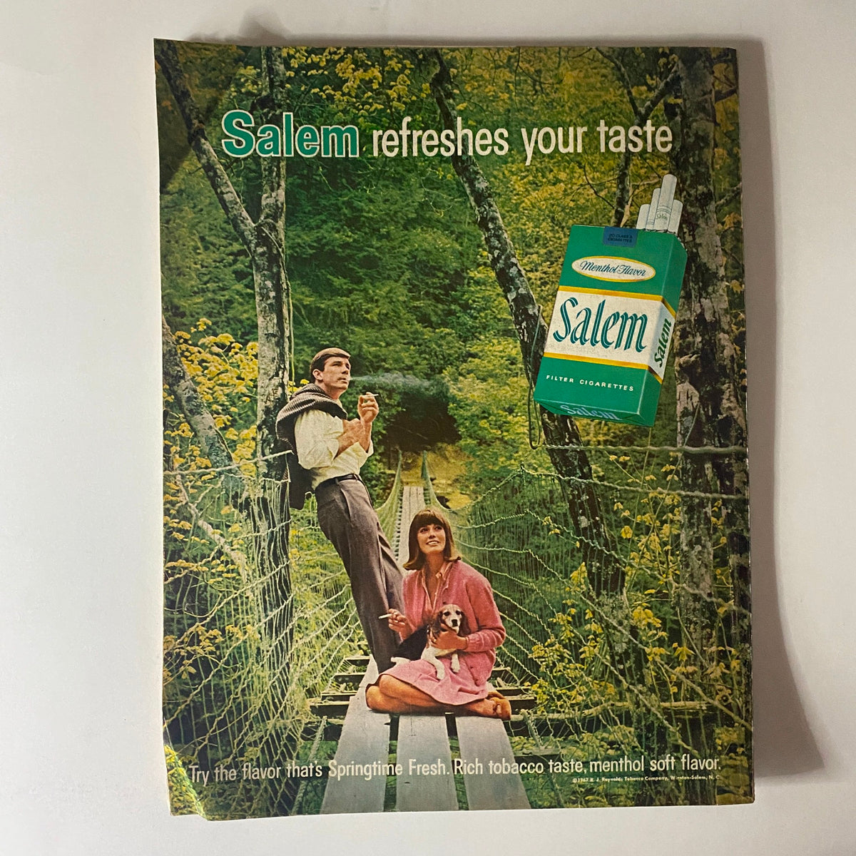 Better Homes & Gardens Magazine December 1967 featuring a vintage advertisement for Salem cigarettes with a serene outdoor scene and a couple walking on a bridge.