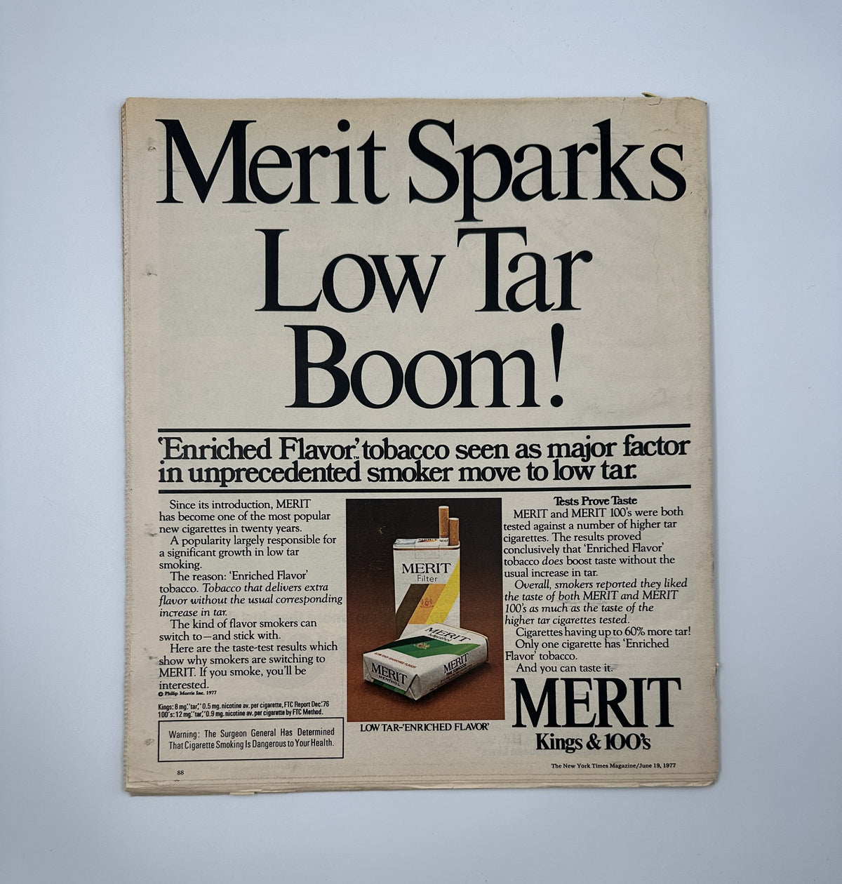Merit Sparks Low Tar Boom! advertisement from The New York Times Magazine June 19, 1977, showcasing the enriched flavor of Merit tobacco and its appeal in promoting a low tar smoking experience.