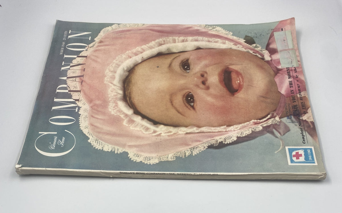 Cover of Woman’s Home Companion Magazine, March 1948, featuring a baby model in a pink bonnet, showcasing vintage magazine design.