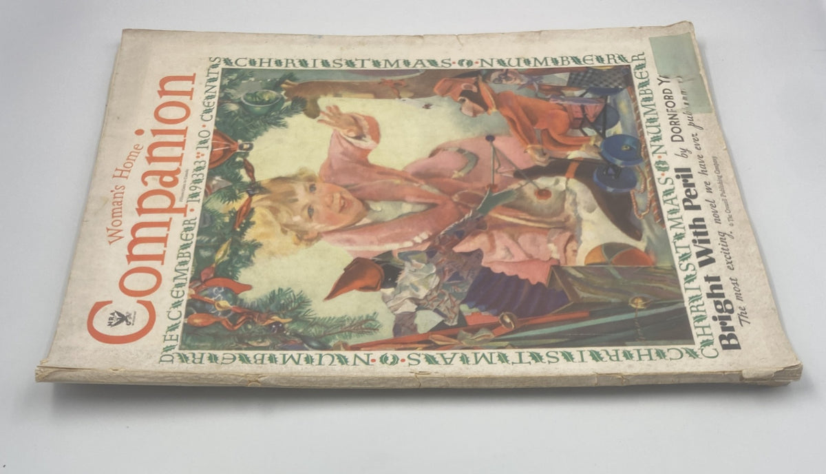 Another view of the Woman's Home Companion Magazine December 1933, showing the cover art titled 'Christmas Bright with Peril' with a child and festive elements.