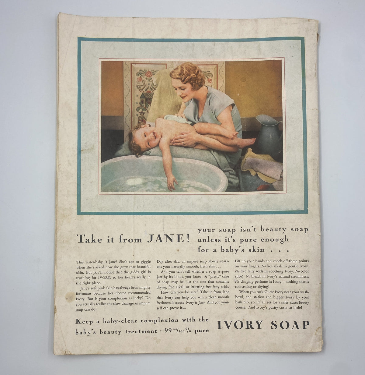 Back cover of Woman's Home Companion Magazine January 1934 featuring a mother giving a baby a bath, promoting Ivory Soap.