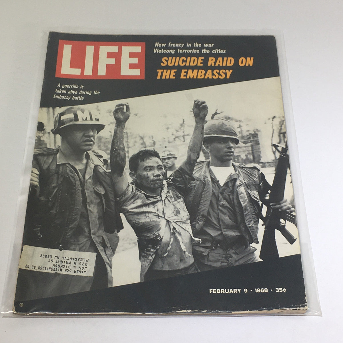Cover of VTG Life Magazine from February 9, 1968, depicting a dramatic scene highlighting the Vietnam War, with features on Vietcong terrorizing cities and the embassy. The magazine illustrates powerful imagery related to the conflict and includes the headline 'Suicide Raid on the Embassy.'
