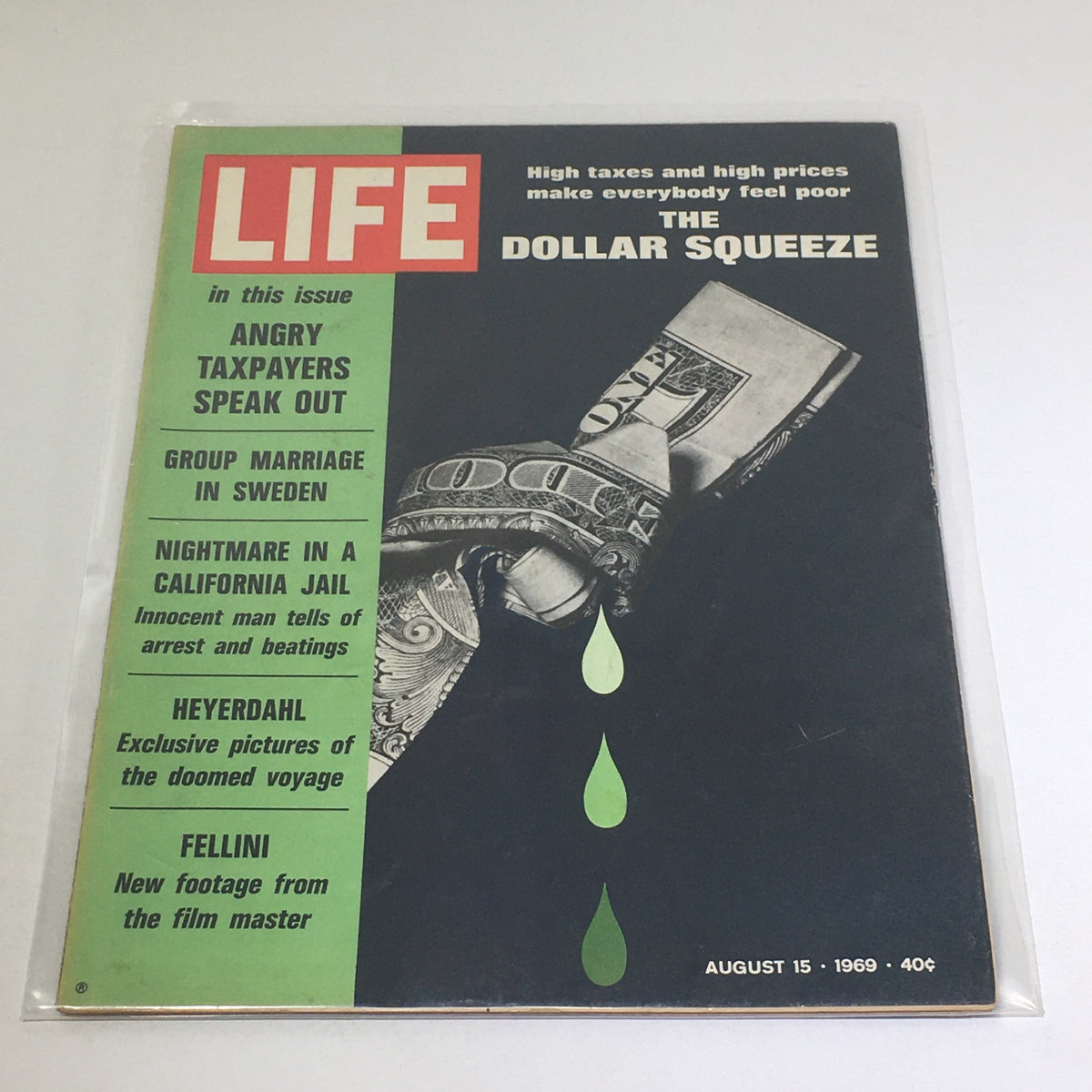 Vintage Life Magazine cover from August 15, 1969, featuring the title 'The Dollar Squeeze' with headlines about angry taxpayers, group marriage in Sweden, and exclusive stories.