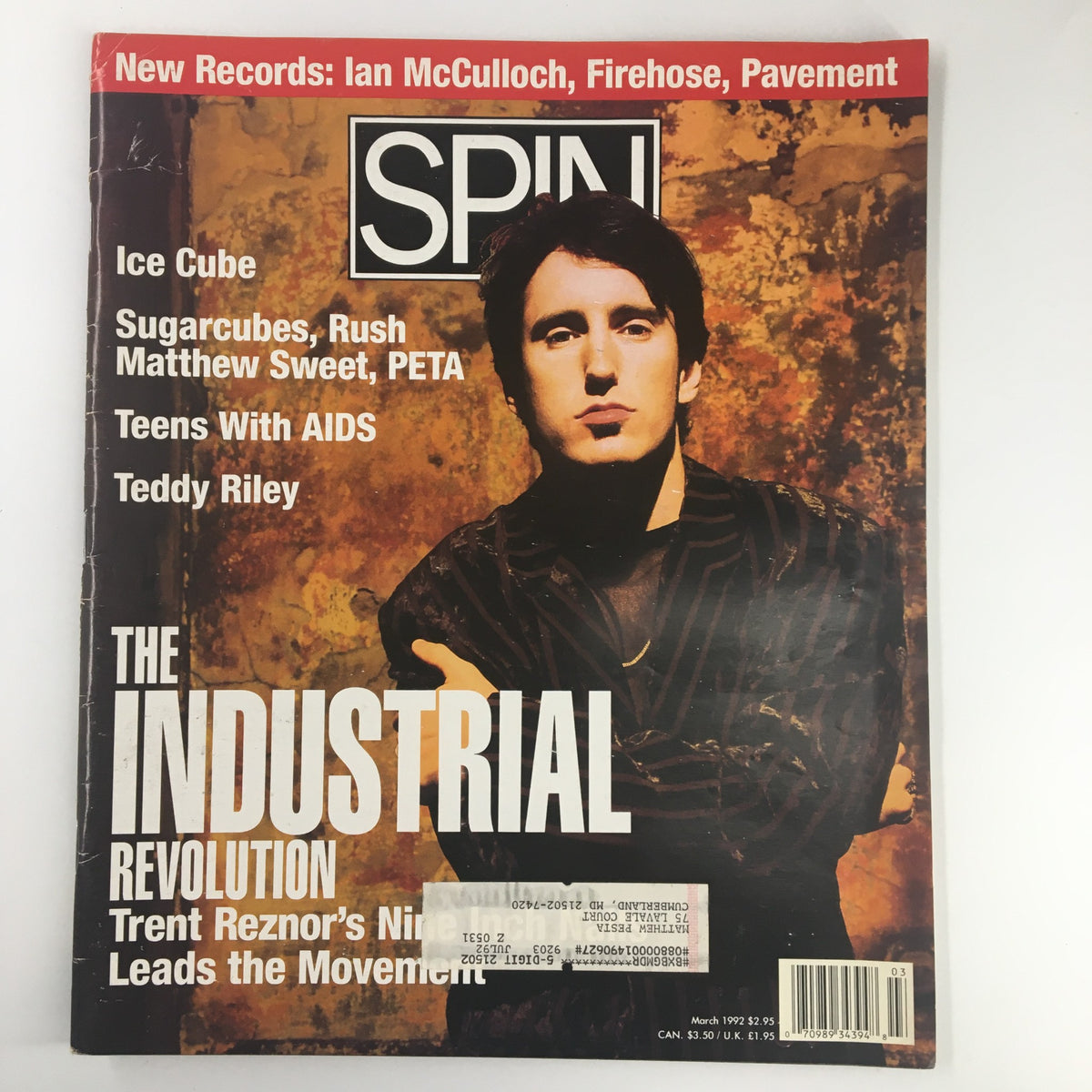 Cover of Spin Magazine March 1992, Vol 7 #12 featuring Trent Reznor, highlighting 'The Industrial Revolution' and notable music trends from the early '90s.