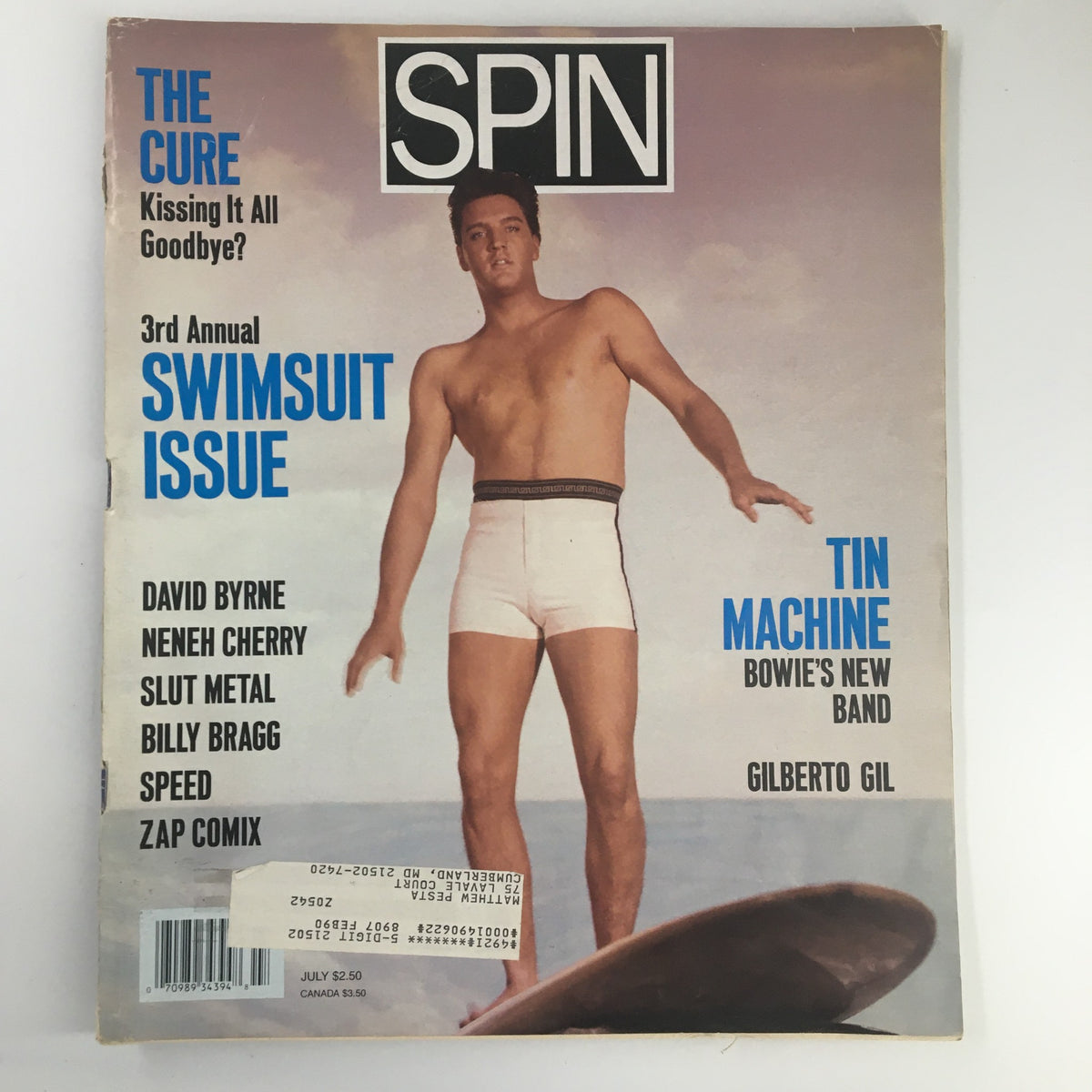 Cover of VTG Spin Magazine July 1989 Vol 5 #4 featuring Elvis Presley on the beach, promoting The Cure's article 'Kissing It All Goodbye?', along with other artists including David Byrne, in a retro design.