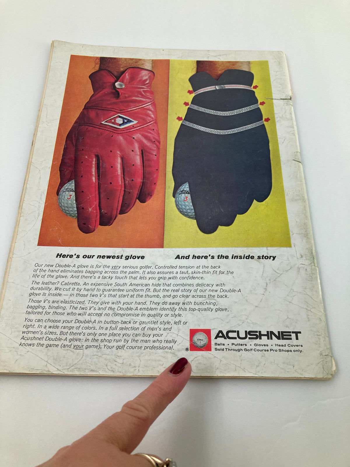 Vintage Golf Digest Magazine March 1966 featuring an advertisement for Acushnet golf gloves. The image shows a comparison of a red glove and a black glove, highlighting their design and features.