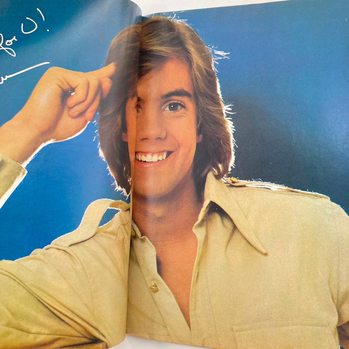 Double-page spread from Tiger Beat Star October 1977 featuring an image of Shaun Cassidy with a bright smile, reinforcing his popularity in the 70s.