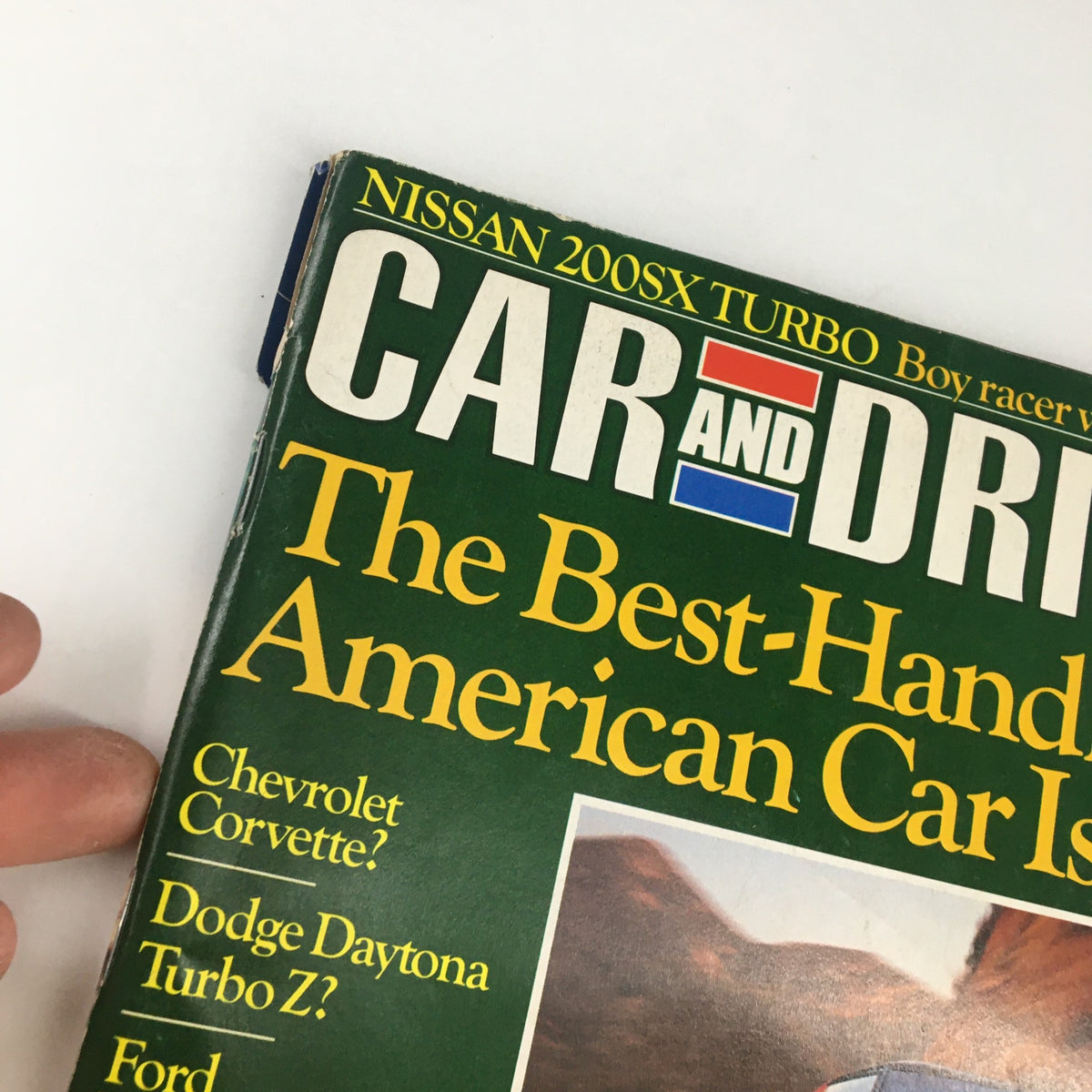 Cover of Car and Driver Magazine May 1984 featuring the Nissan 200SX Turbo, titled 'Boy Racer with a Boosted Ego', showcasing the magazine's bold graphics and automotive focus.