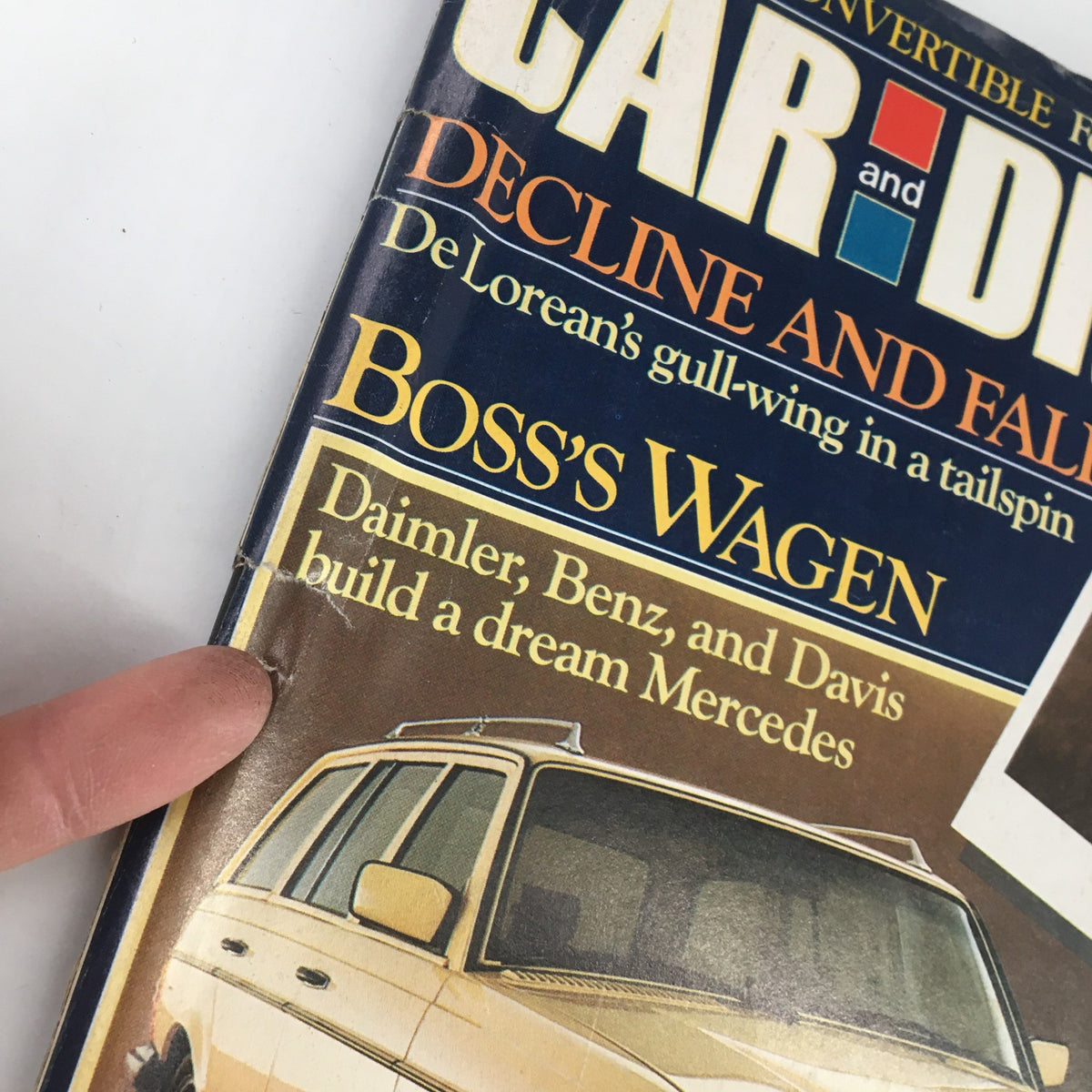 Detail of Car and Driver Magazine July 1982 cover emphasizing the title 'Daimler, Benz, and Davis build a dream Mercedes' alongside an image of the Mercedes.