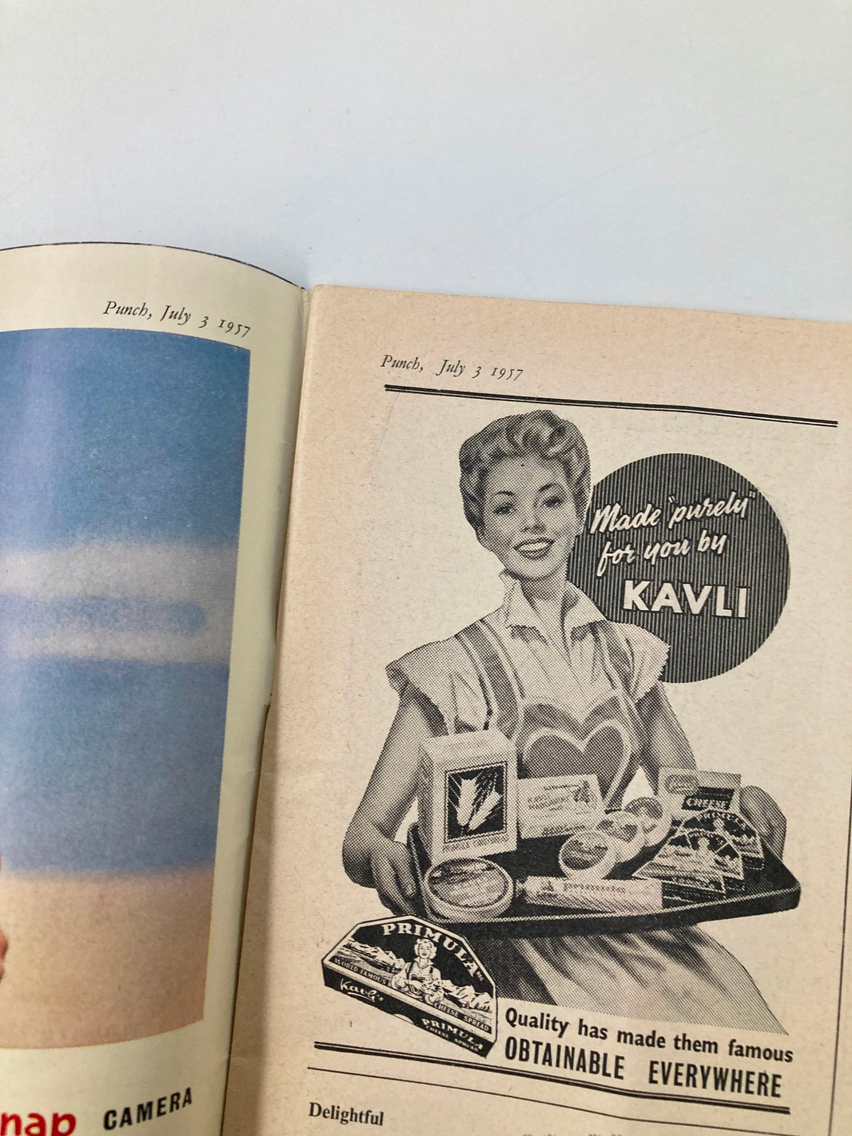 VTG Punch Magazine July 3 1957 featuring an advertisement with a smiling woman presenting a tray of products, including Kavli and Primula items, showcasing vintage design and post-WWII culture.