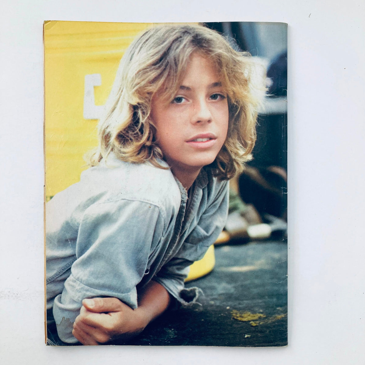 Vintage photograph of a young boy with long hair, laying down, featured in Tiger Beat Magazine January 1978, capturing teen idol charm of the 1970s.