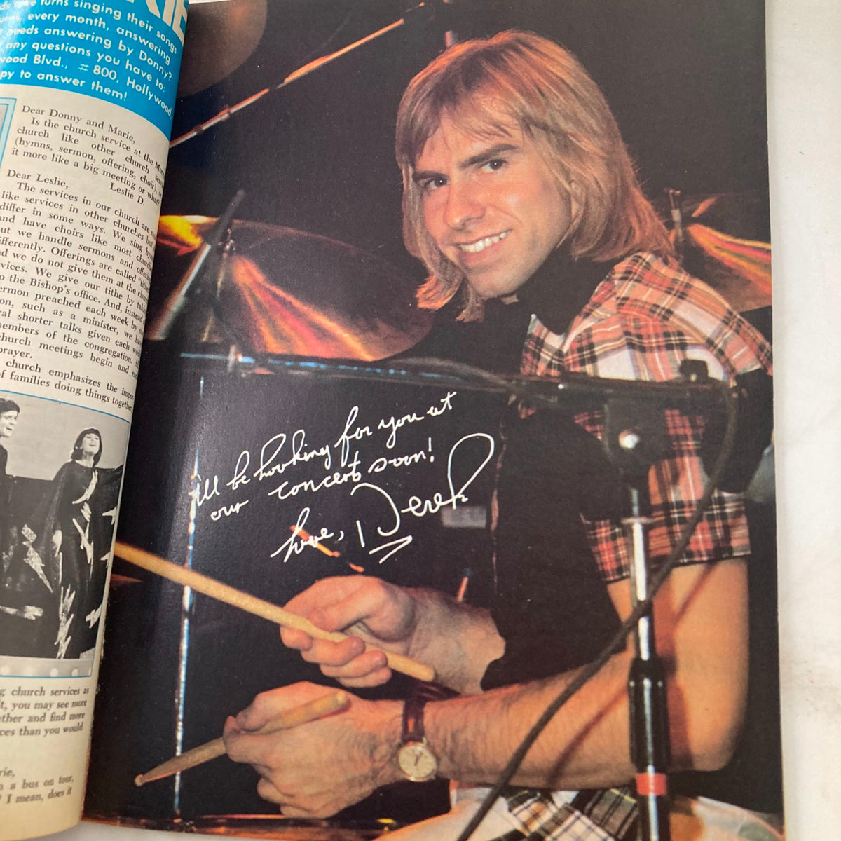 A drum performance photo of a musician from the Tiger Beat Star Magazine May 1977, with an inscription signing off as Derek.