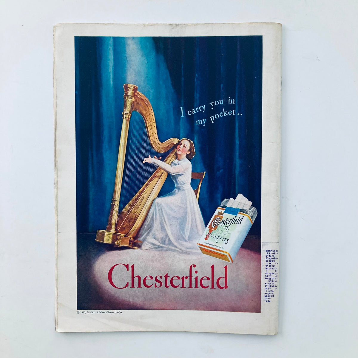 Vintage advertisement for Chesterfield cigarettes featured in the VTG Time Magazine August 24 1936, depicting a woman playing harp with the slogan 'I carry you in my pocket'.