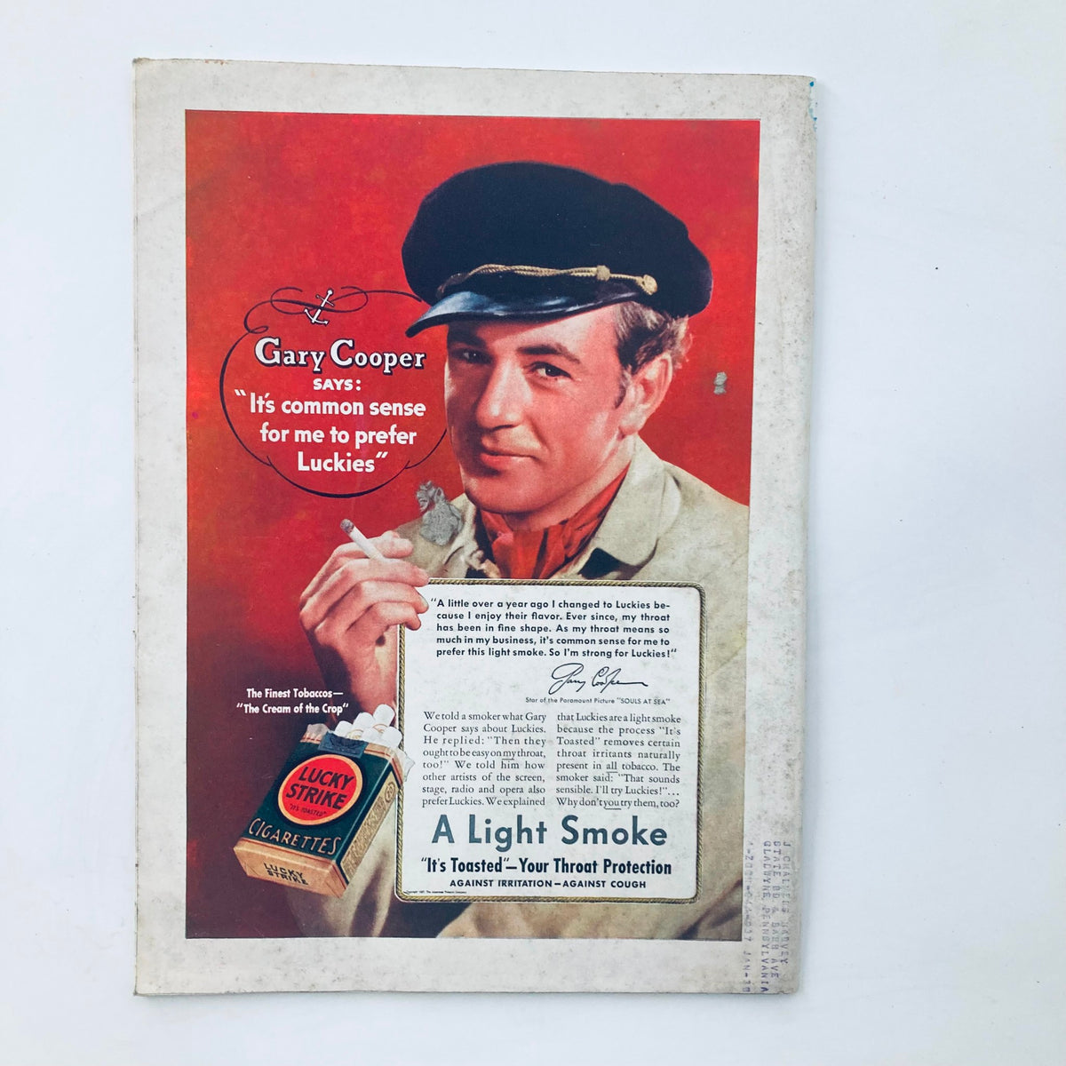 Vintage advertisement featuring Gary Cooper promoting Lucky Strike cigarettes, emphasizing its smooth flavor and throat protection. This ad aligns with the VTG Time Magazine August 9 1937 issue featuring Majesty Farouk I, King of Egypt.