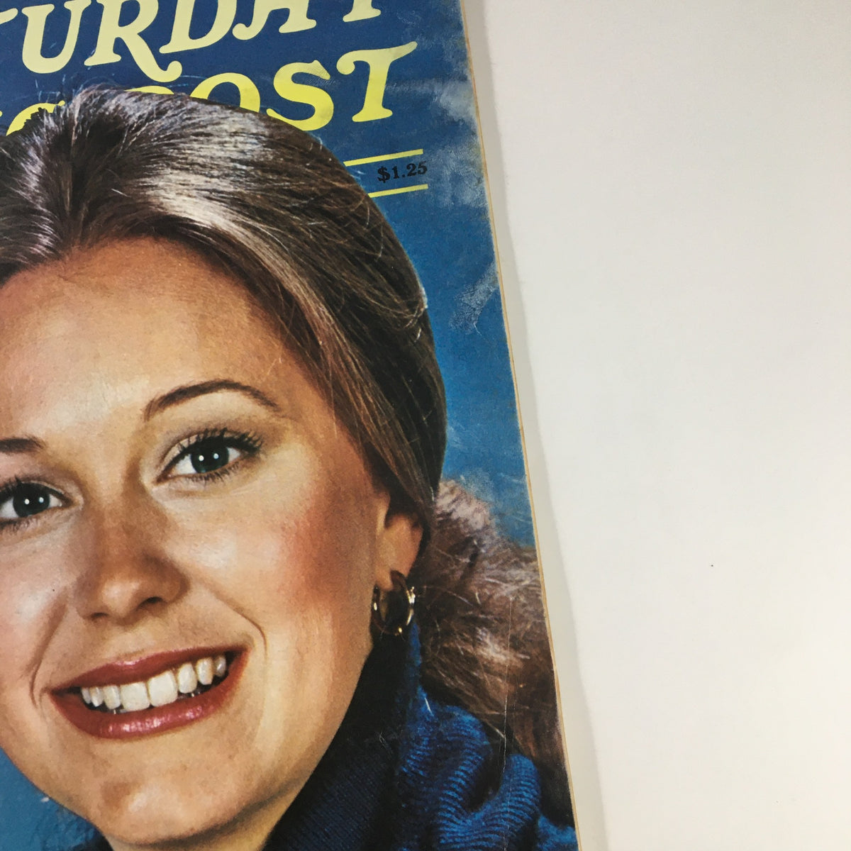 Close-up of The Saturday Evening Post February 1977 magazine cover highlighting Jane Pauley's image and the title 'Dawn's Early Sprite'. The detail captures Pauley's friendly expression and hairstyle.