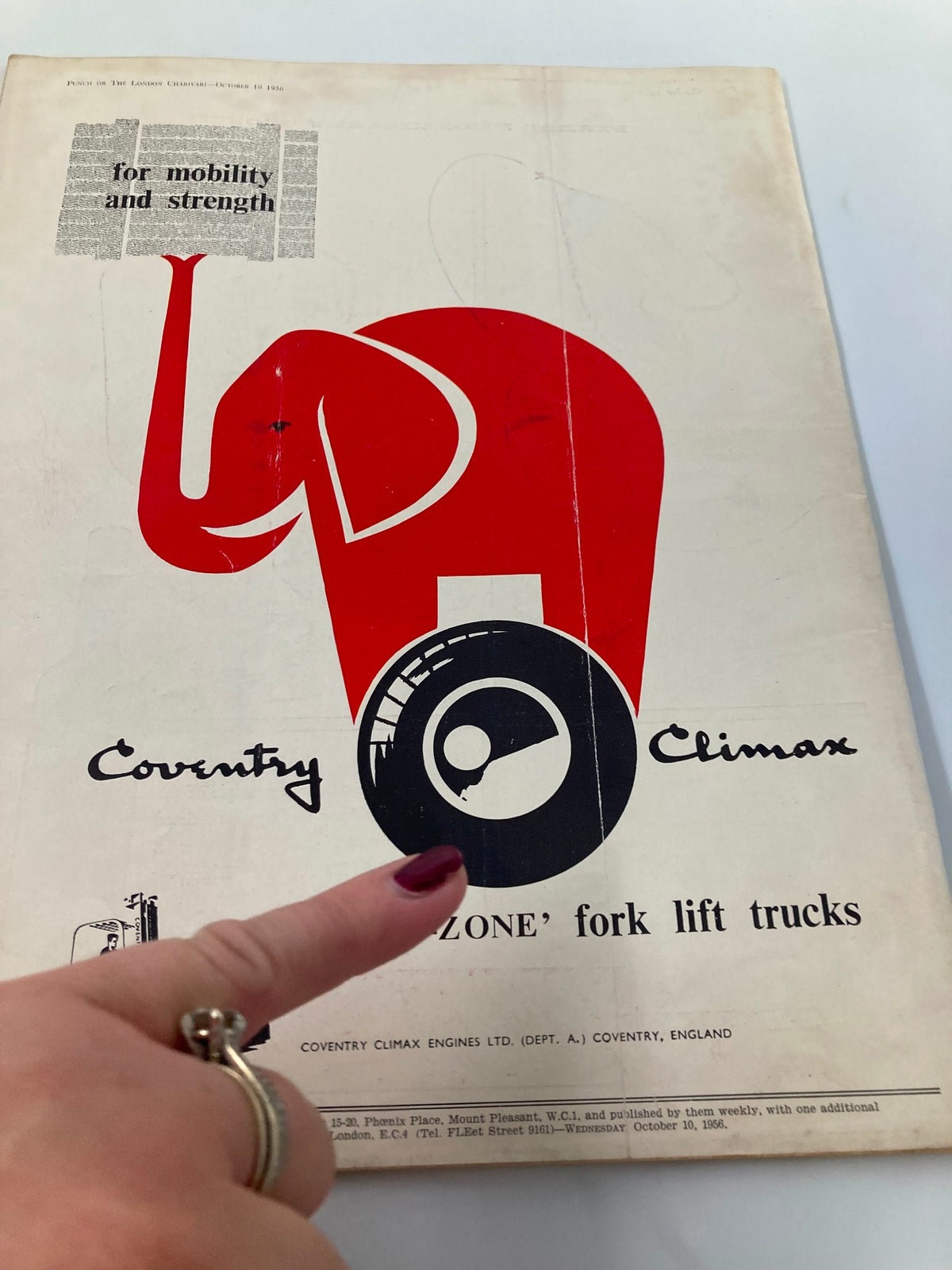 Vintage Punch Magazine October 10, 1956 cartoon illustration featuring an elephant logo for Coventry Climax fork lift trucks, emphasizing post-WWII humor and design from the 1950s.