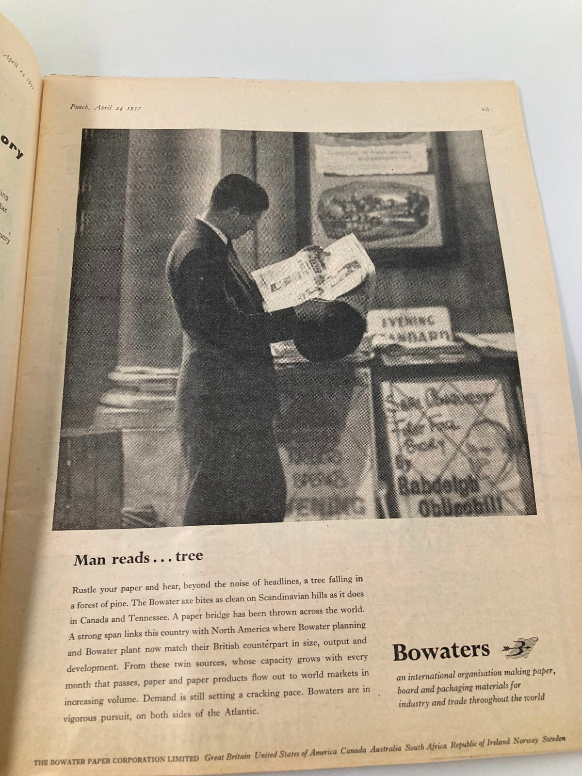 Interior page from VTG Punch Magazine April 24 1957 depicting a man reading a newspaper, illustrating the cultural context of media consumption during the era.