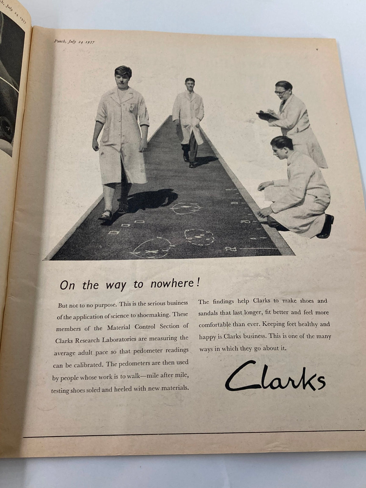 Inside page of VTG Punch Magazine July 24 1957, featuring a photograph of researchers at Clarks Research Laboratories discussing the calibration of pedometers.