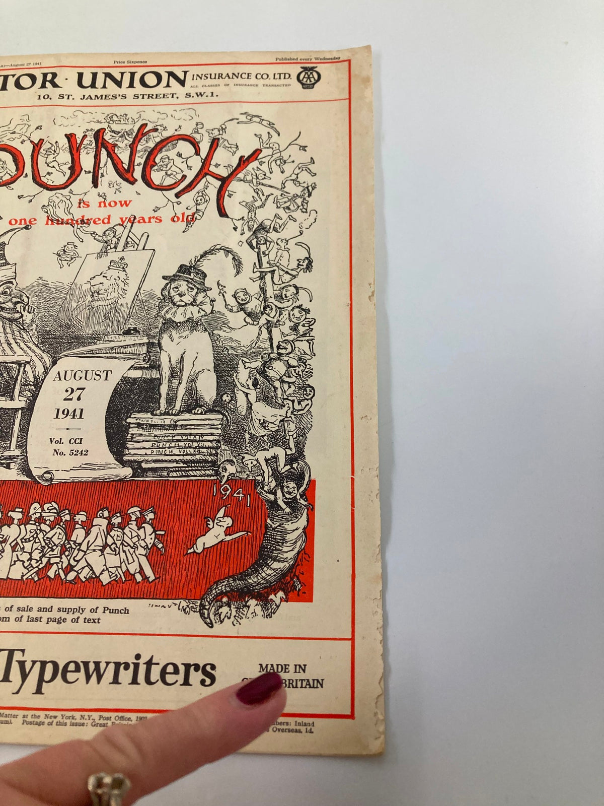 Side view of the cover of VTG Punch Magazine, August 27, 1941, showcasing the magazine's design celebrating its centenary with humorous illustrations.
