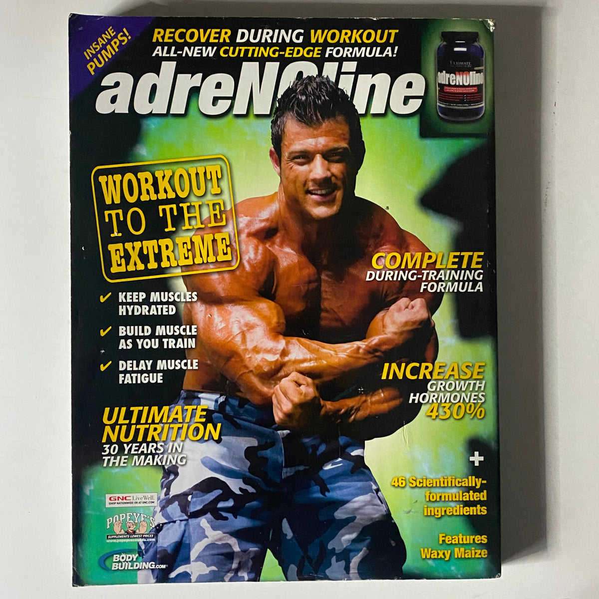 Cover of adreMaine supplement magazine, emphasizing muscle recovery and training performance, showcasing a muscular bodybuilder with the title of Muscular Development Magazine July 2009 Vol 46, Num 7.