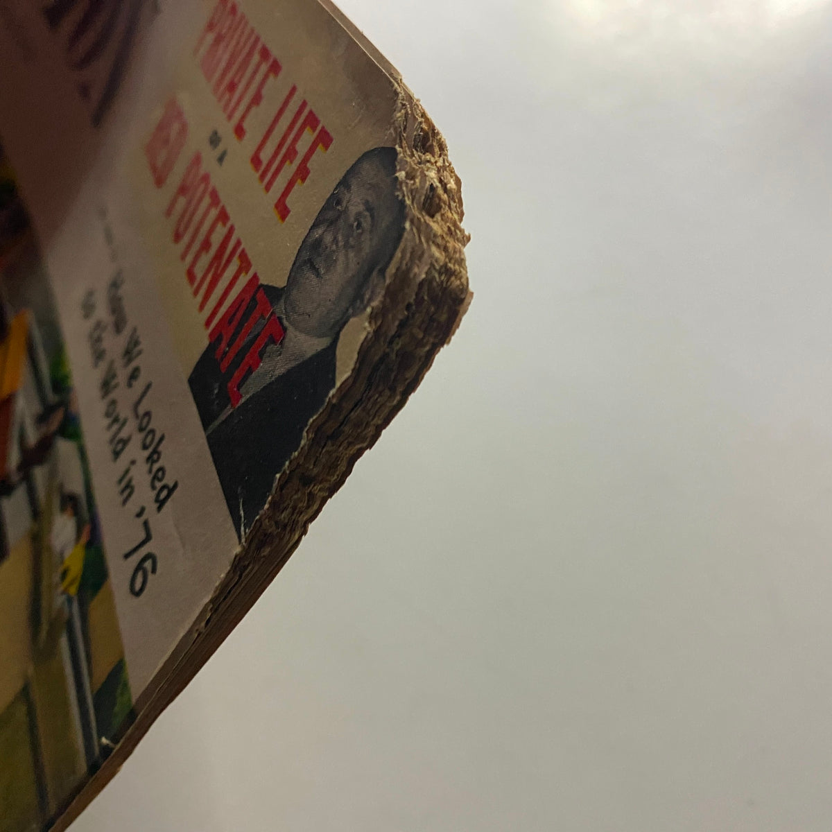Edge view of The American Legion Magazine, July 1957, showcasing the magazine's age with slightly weathered pages and visible wear, including the title 'Private Life of a Red Potentate' prominently displayed.