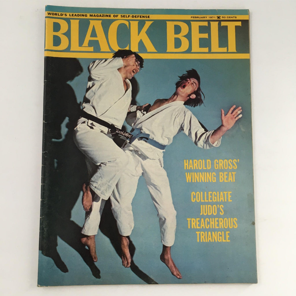 Cover of Black Belt Magazine, February 1971 featuring Harold Gross and Jay Friedman in dynamic martial arts poses, showcasing techniques and culture of that era.