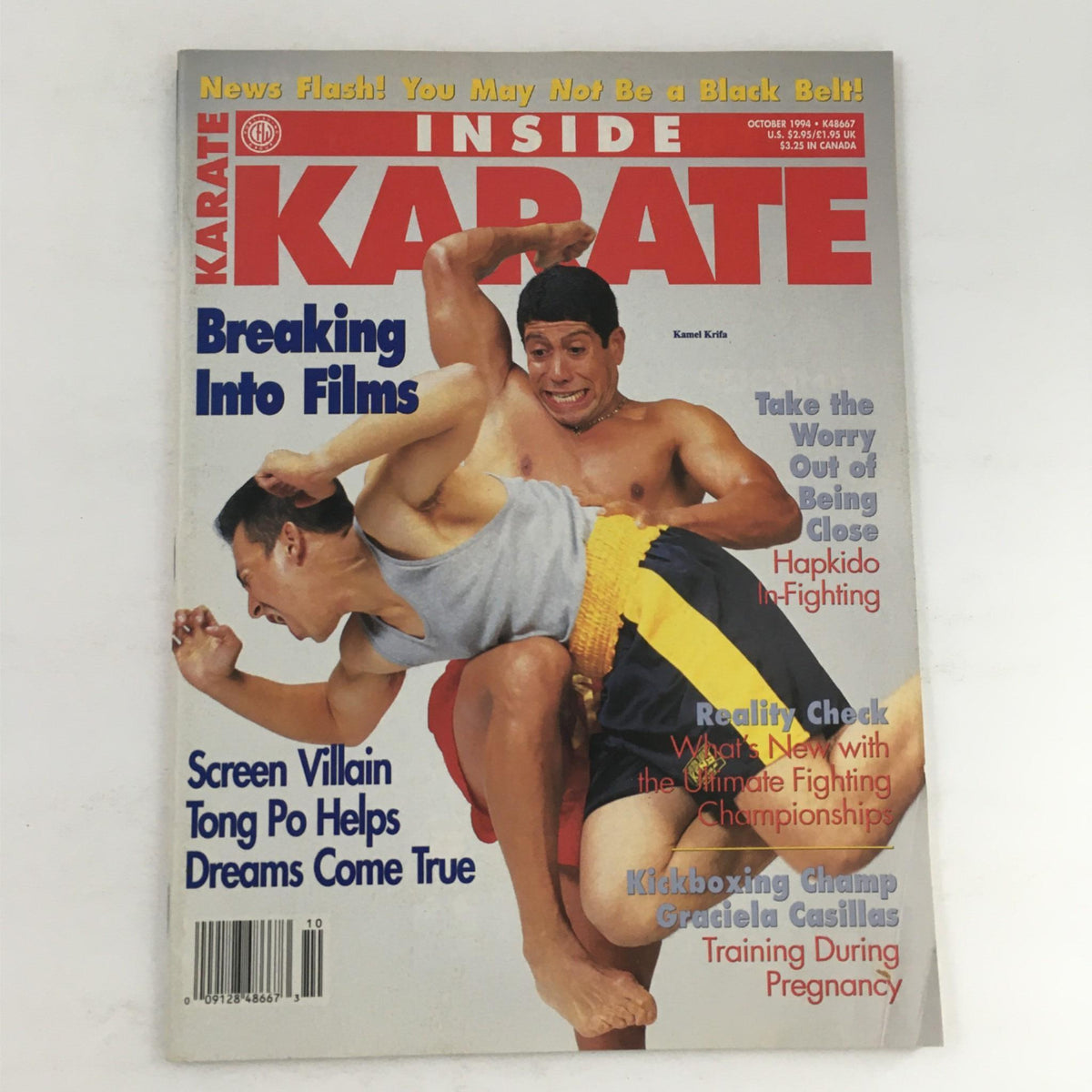 Inside Karate Magazine October 1994 featuring Kamel Krifa on the cover, showcasing martial arts scenes and articles including training tips and interviews.