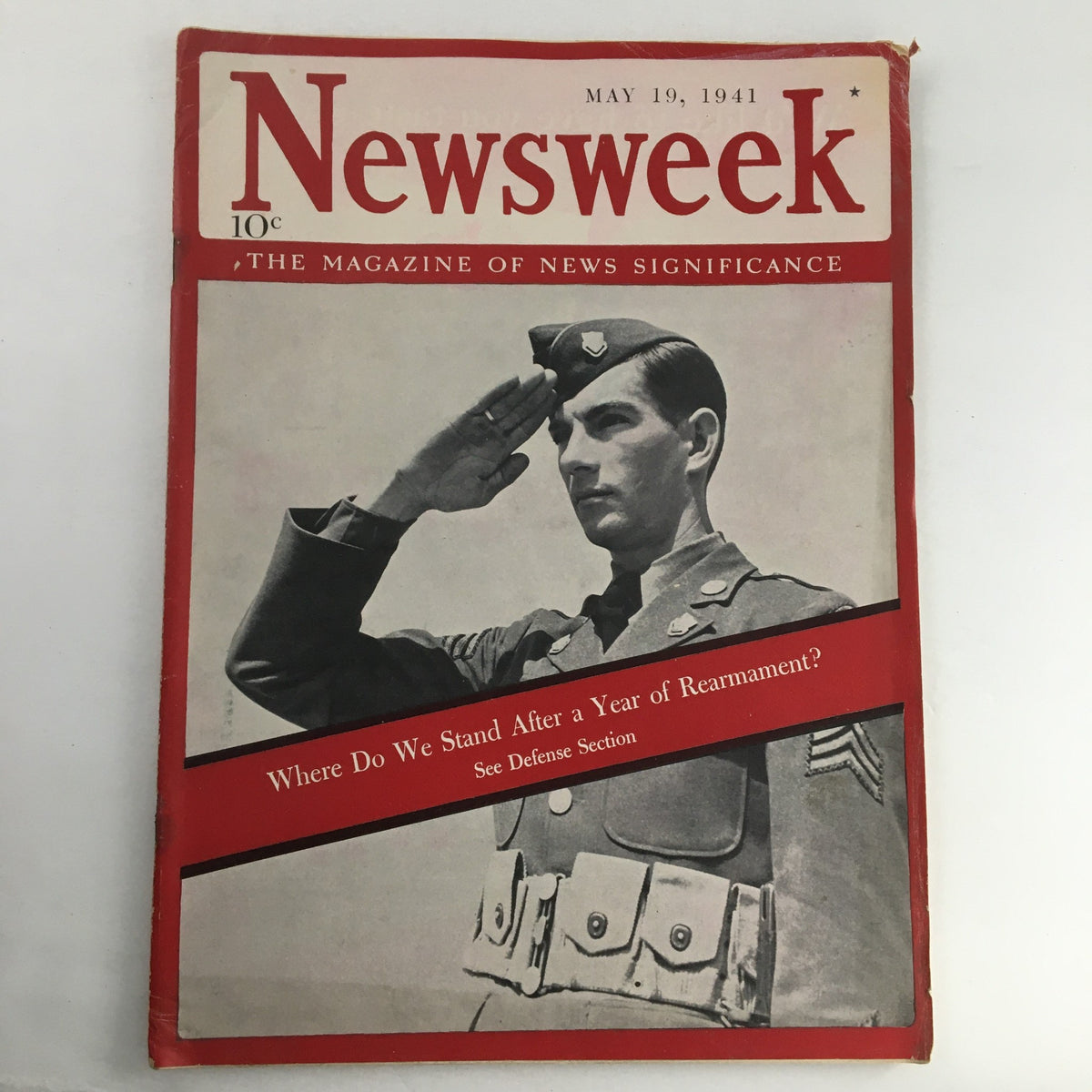 Cover of Newsweek Magazine from May 19, 1941, featuring a soldier saluting and the title 'Where Do We Stand After a Year of Rearmament?' highlighting historical significance.