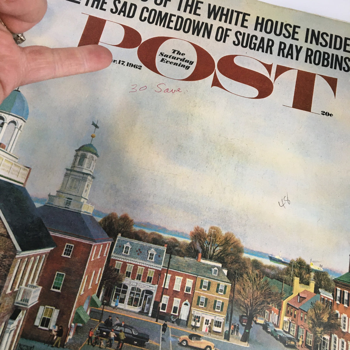 Close-up of the March 17, 1962 cover of The Saturday Evening Post, highlighting the article 'The Wives of the White House Insiders' with a detailed image of a town scene.