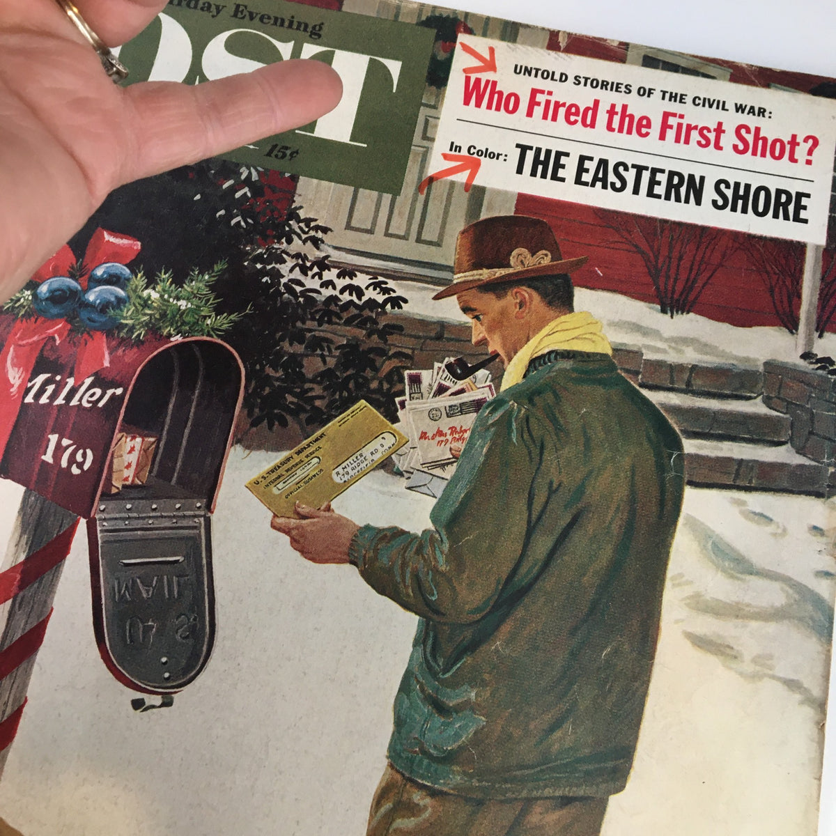 Close-up of The Saturday Evening Post cover from December 17, 1960, highlighting the story 'Who Fired The First Shots?' alongside a winter scene with a man holding mail.