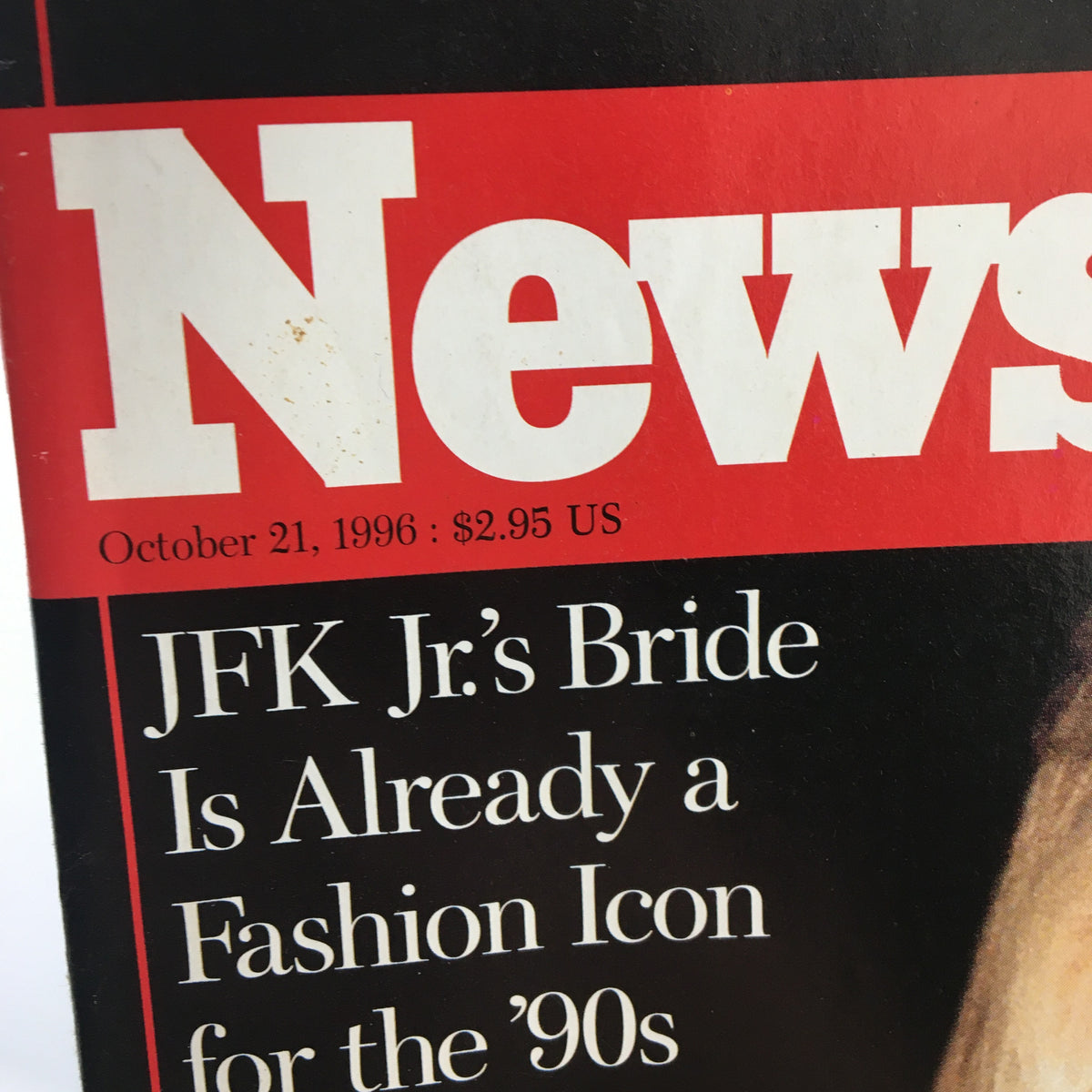 Close-up detail of Newsweek Magazine cover from October 21, 1996, highlighting the title and text about JFK Jr.'s bride as a fashion icon for the '90s.