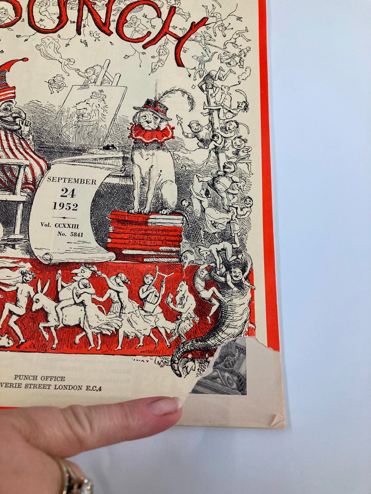 Close-up of VTG Punch Magazine cover from September 24, 1952, showcasing the playful artwork, including a clown, a dog in a festive collar, and whimsical characters. The magazine reflects mid-20th century humor and is a part of Volume 223, Issue #5841.