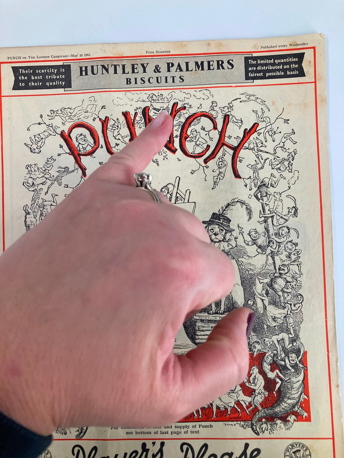 Cover of VTG Punch Magazine May 20 1942 #5282 Vol 202 showcasing vintage artwork with a hand pointing at the title 'PUNCH' prominently displayed, reflecting WWII humor.