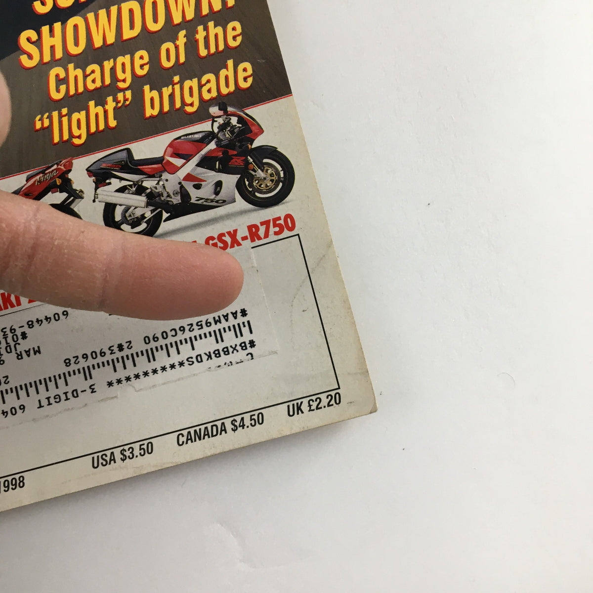 Back cover of Cycle World Magazine April 1998 showing a featured Suzuki GSX-R750 motorcycle and promotional details of the magazine. Includes an address label and pricing information.