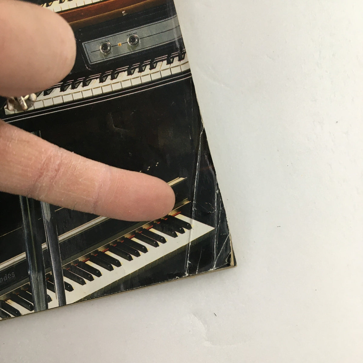 Detail of Keyboard Magazine May 2002 showing edge wear and tear with a partial view of piano keys.