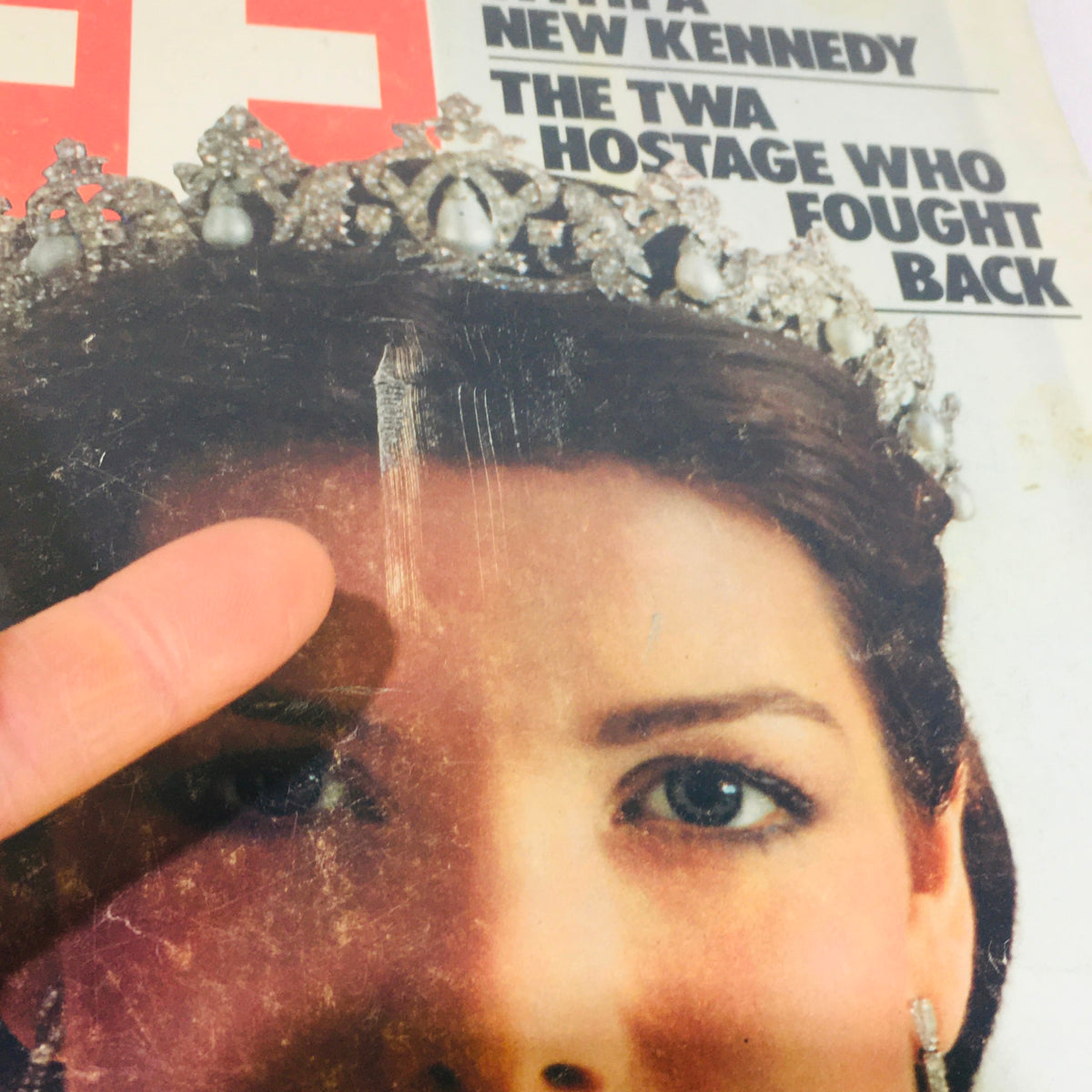 Close-up of the Vintage Life Magazine cover from April 1986 highlighting the details of the woman in a tiara and the headline 'Campaigning With A New Kennedy / The TWA Hostage Who Fought Back'.