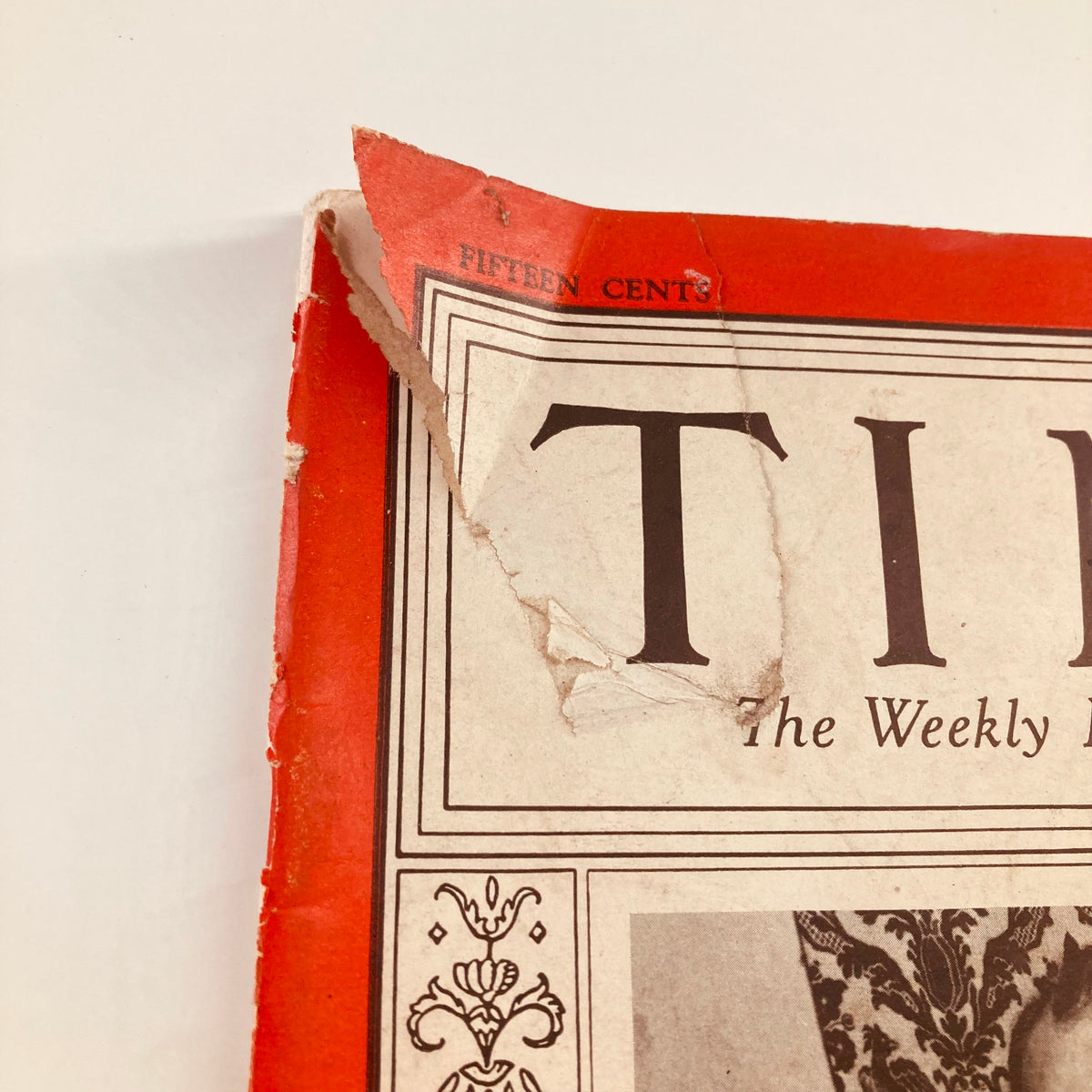 Close-up of the damaged corner of the VTG Time Magazine February 8 1937, showing wear and tear with a visible tear and creases.